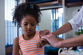 Little girl getting a shot.