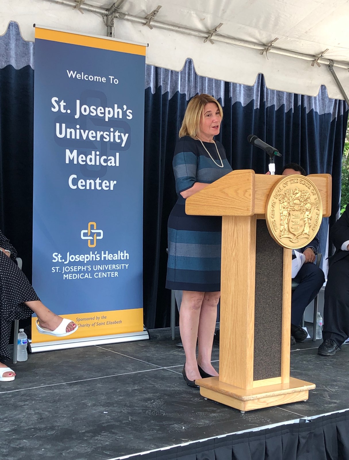 Cathy Bennett speaking at St. Joseph's University Medical Center for supportive housing.