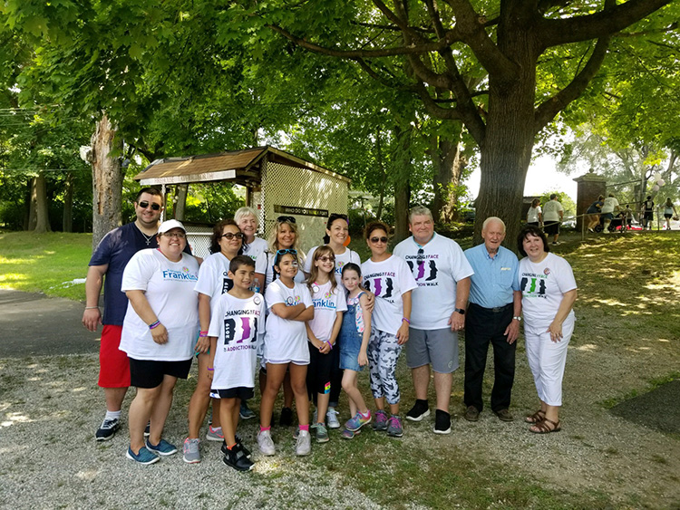 Group of adults and children posing for the Hunterdon addiction walk