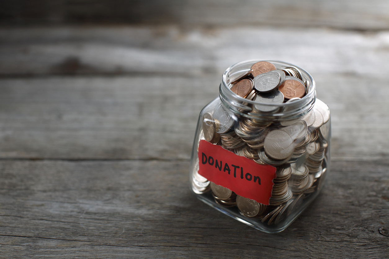 Jar of change with 'Donation' label.