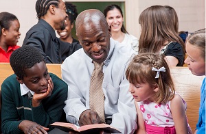 Man teaching children.