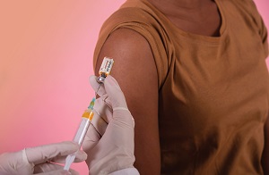 A person about to receive a shot.