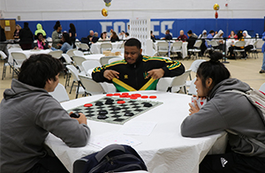 Students playing checkers.