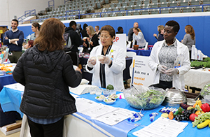 Representatives offering fruits and vegetables.