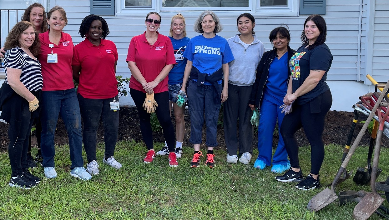 Social Determinants of Health featuring an image of 10 women from RWJ Barnabas volunteers for Healing Homes