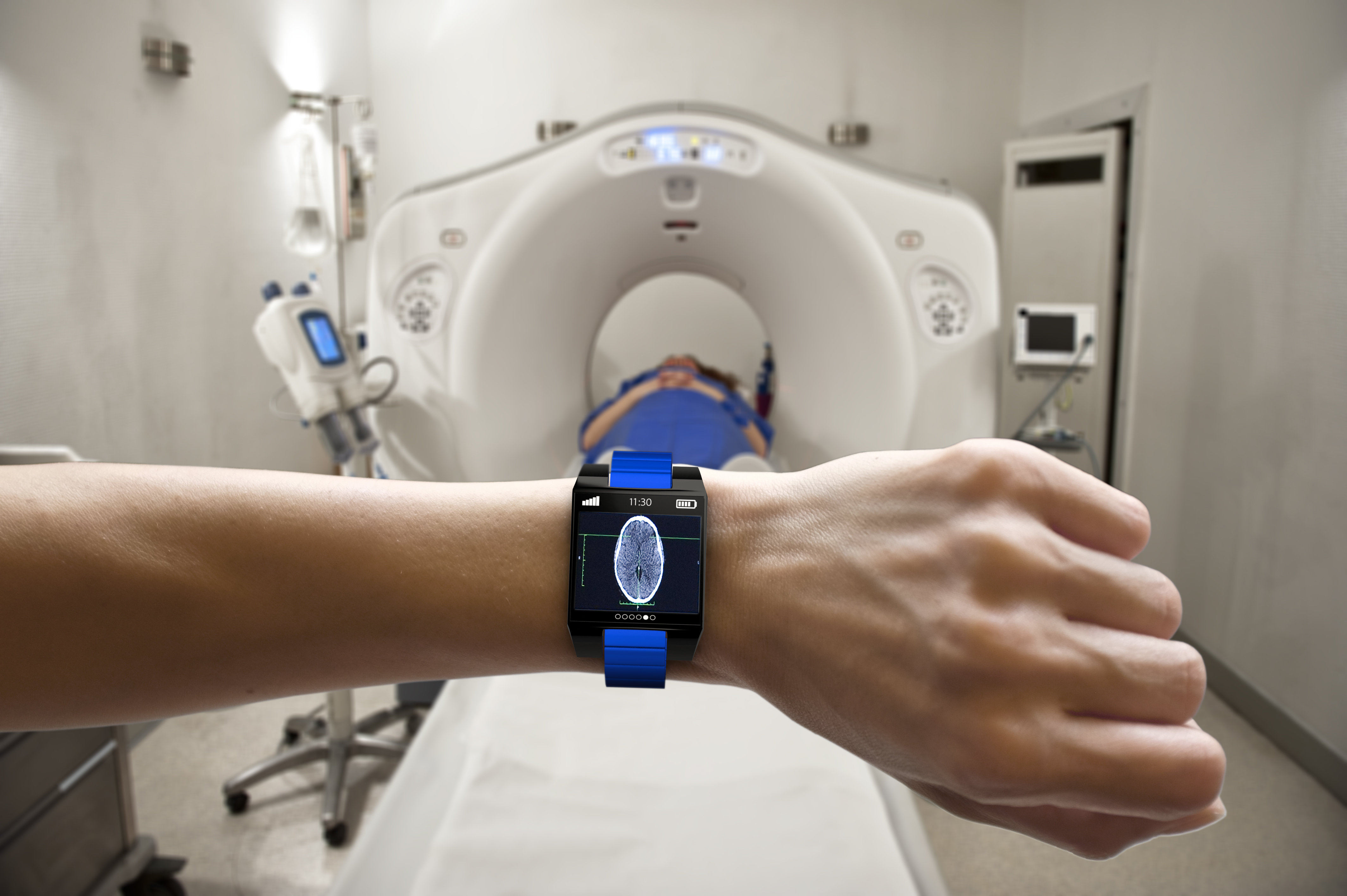 Innovation features an image of a closeup of a forearm and hand of someone wearing a smart watch with a scan of a human brain on the face of the watch. In the background is an MRI machine with a patient lying on the sliding table inside the machine